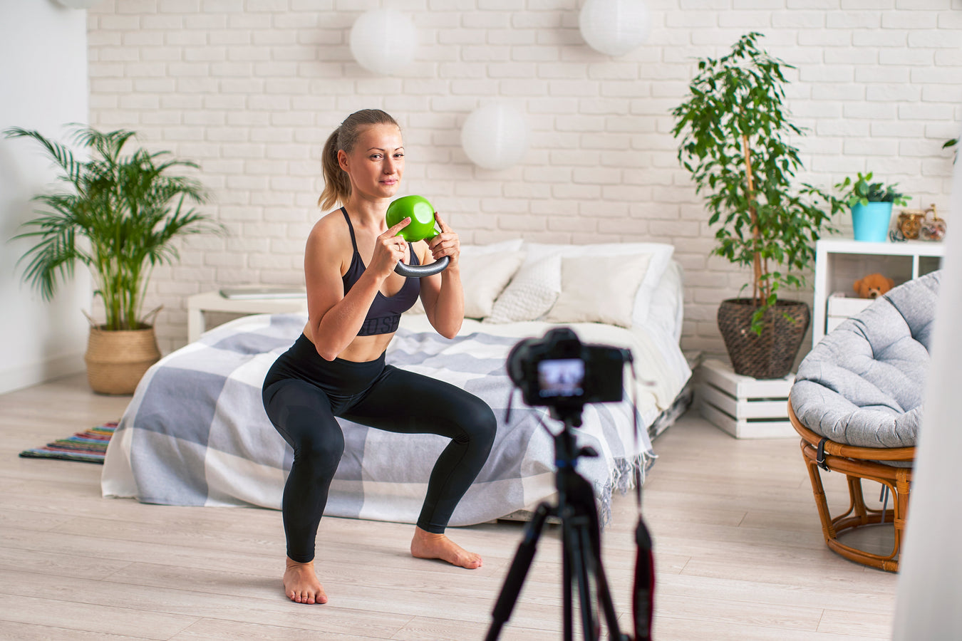 Fitness instructor using camera to stream virtual classes on video